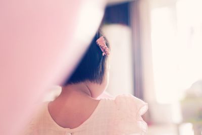 Close-up of woman with hand on hair