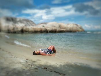 Woman sitting on beach