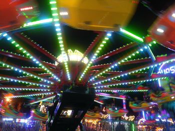 Low angle view of illuminated lights at night