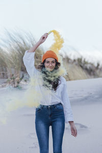 Woman wearing hat standing in snow