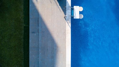 High angle view of swimming pool by wall