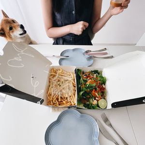 Midsection of woman preparing food on table