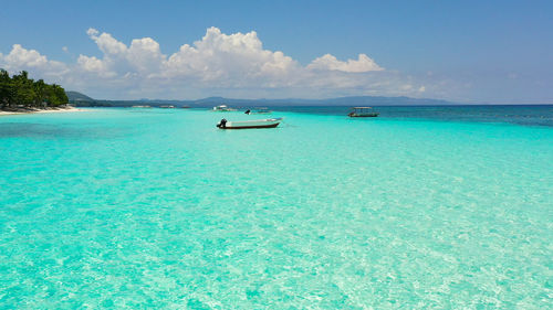 Scenic view of sea against blue sky