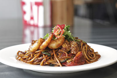 Close-up of mie goreng in plate on table