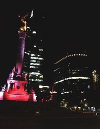 Low angle view of illuminated buildings at night