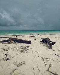 Scenic view of sea against cloudy sky
