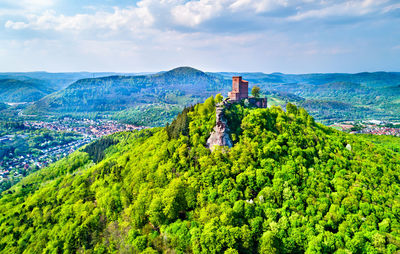 Panoramic view of trees and buildings against sky