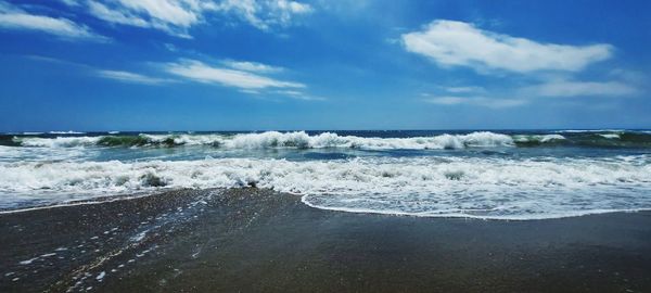 Scenic view of beach against sky