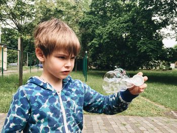 Boy playing with bubble blower