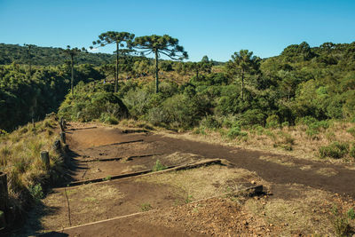 Rough pathway and people at the itaimbezinho canyon near cambará do sul. brazil.