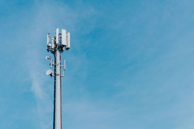 Low angle view of floodlight against sky