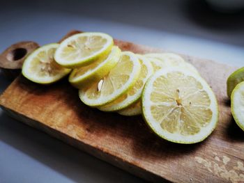 High angle view of sliced lemons on cutting board