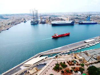 High angle view of harbor by sea against sky