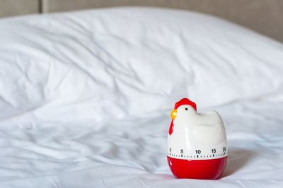 High angle view of red toy on bed at home