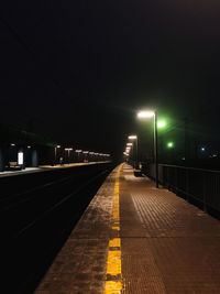 Railroad station platform at night