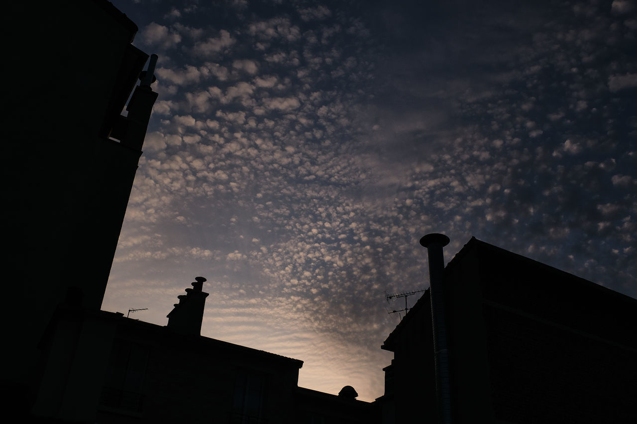 LOW ANGLE VIEW OF SILHOUETTE BUILDING AGAINST SKY AT SUNSET