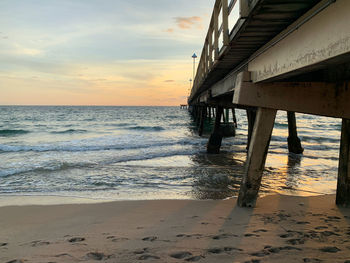 Scenic view of beach against sky during sunset