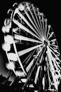 Low angle view of illuminated ferris wheel