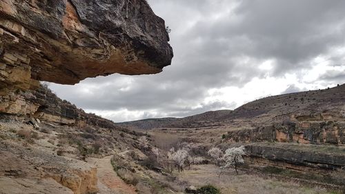 Scenic view of mountain against cloudy sky