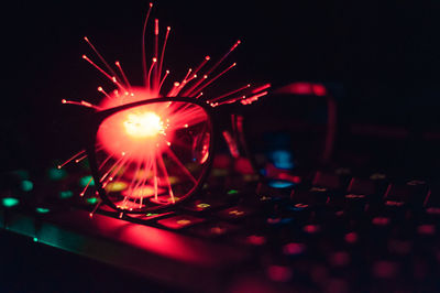 Close-up of illuminated lighting equipment on table