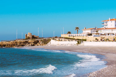 Beach of the touristic village of nerja, costa del sol, province of málaga, spain.