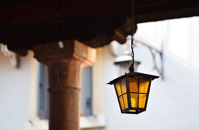 Low angle view of illuminated lantern hanging on ceiling