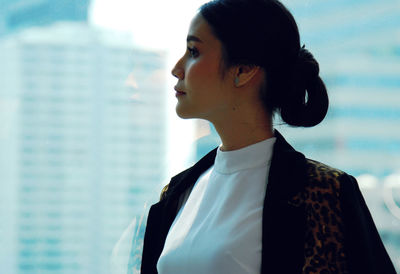 Portrait of young woman looking away