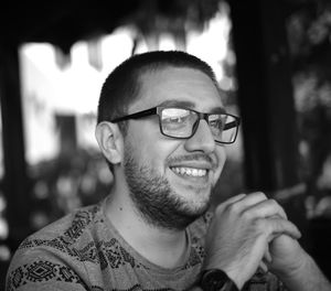 Close-up portrait of smiling young man