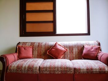 Red couch by window