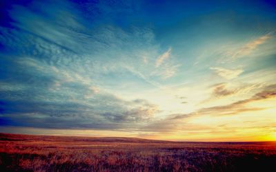 Countryside landscape against scenic sky