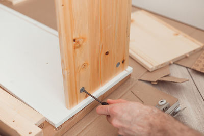 High angle view of man working on wood