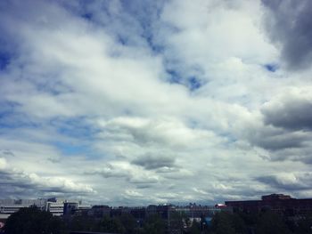 Buildings in city against sky