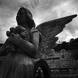 Low angle view of statue against sky