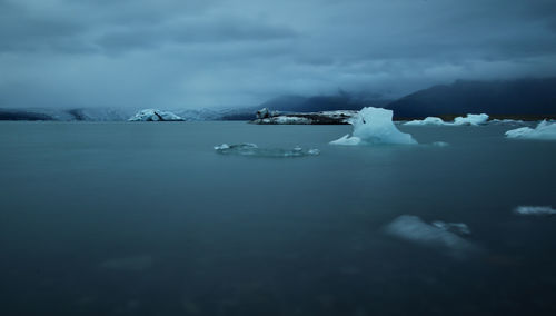 Scenic view of frozen sea against sky