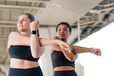 Young woman exercising in gym