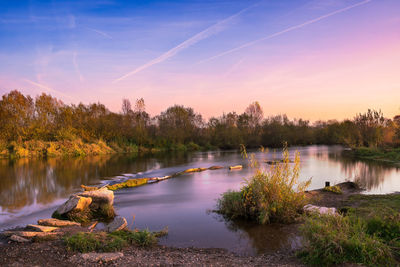 Scenic view of main river against sky during sunset