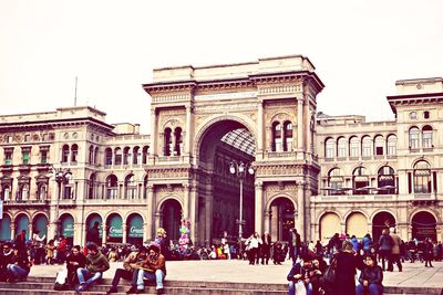 Tourists in front of building