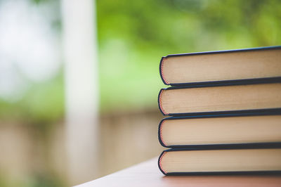 Stack of books on table at home