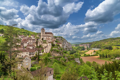 View of saint-cirq-lapopie village with catholic church, france