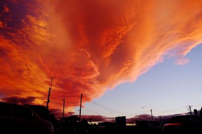 Silhouette car against sky during sunset