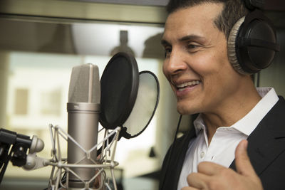 Portrait of smiling man using mobile phone