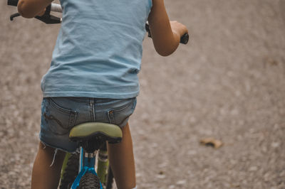 Low section of boy on bike 