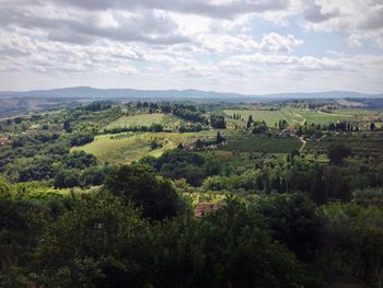 Scenic view of landscape against cloudy sky