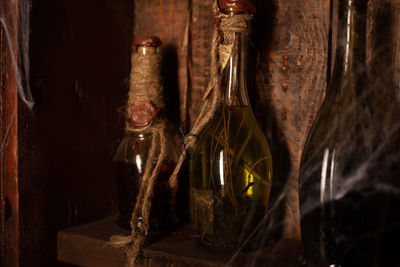 Close-up of glass bottles on shelf