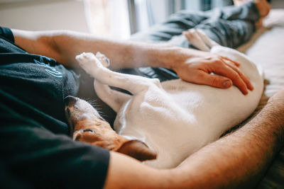 Midsection of man lying down