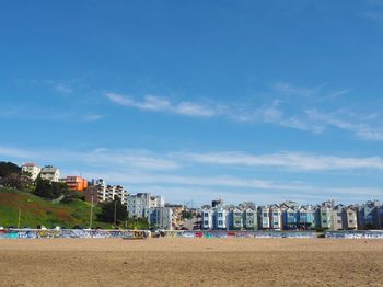 View of beach with city in background