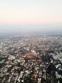 High angle view of city buildings against clear sky