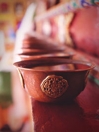 Close-up of lit tea light candles in temple