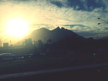 Scenic view of silhouette mountains against sky at night