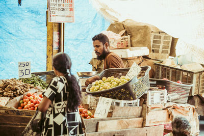 People at market stall